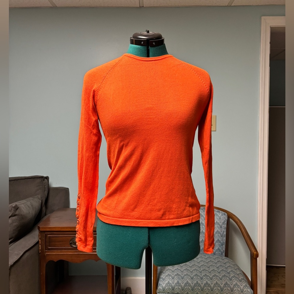 Orange knit shirt with cute button detail